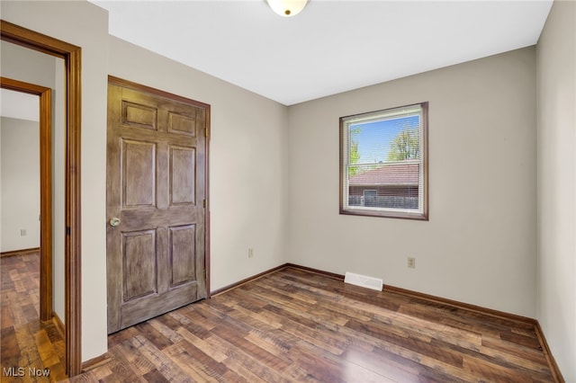 241 W Good Ave, Wadsworth, OH 44281 - unfurnished bedroom featuring wood finished floors and baseboards