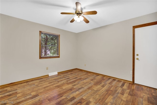 241 W Good Ave, Wadsworth, OH 44281 - empty room with wood finished floors, a ceiling fan, and baseboards