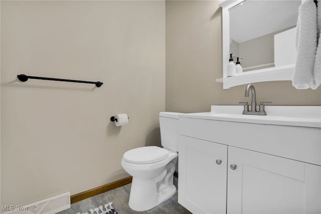 241 W Good Ave, Wadsworth, OH 44281 - bathroom featuring toilet, wood finished floors, vanity, and baseboards