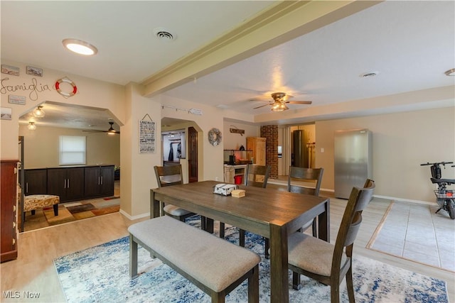 274 2nd St, Lake Milton, OH 44429 - dining area with ceiling fan, arched walkways, light wood-type flooring, and baseboards