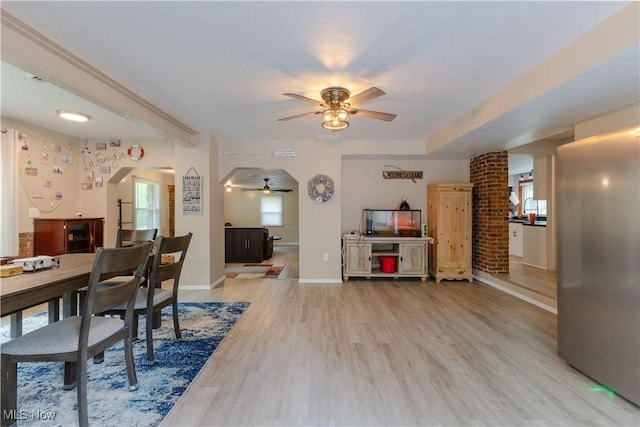 274 2nd St, Lake Milton, OH 44429 - dining area with ceiling fan, baseboards, and light wood-style floors