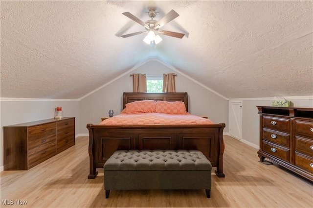 274 2nd St, Lake Milton, OH 44429 - bedroom featuring a textured ceiling, light wood-style flooring, baseboards, ceiling fan, and lofted ceiling