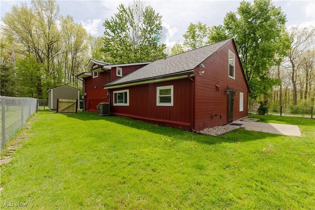 274 2nd St, Lake Milton, OH 44429 - view of property exterior featuring central air condition unit, an outdoor structure, and a shingled roof