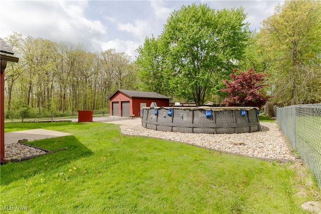 274 2nd St, Lake Milton, OH 44429 - view of yard with a detached garage and an outbuilding