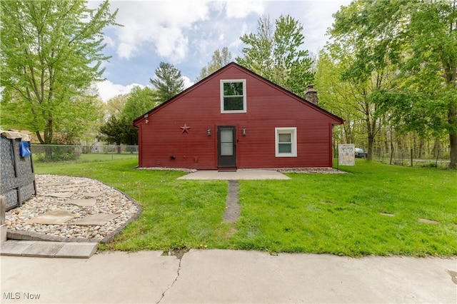 274 2nd St, Lake Milton, OH 44429 - back of property with a chimney and a patio