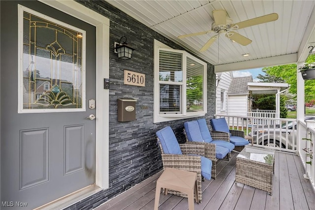 5610 Charles Ave, Parma, OH 44129 - wooden deck with covered porch and ceiling fan