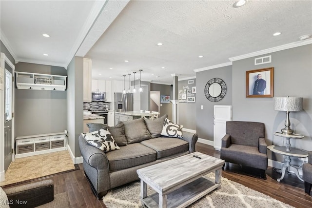 5610 Charles Ave, Parma, OH 44129 - living area with recessed lighting, ornamental molding, wood finished floors, baseboards, and a textured ceiling