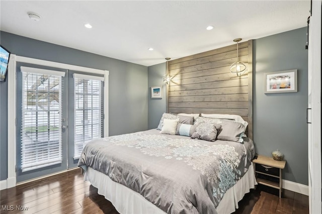 5610 Charles Ave, Parma, OH 44129 - bedroom with access to exterior, dark wood-style floors, baseboards, recessed lighting, and wooden walls