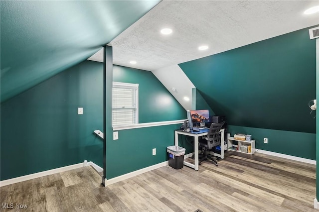 5610 Charles Ave, Parma, OH 44129 - office space with a textured ceiling, wood finished floors, baseboards, vaulted ceiling, and recessed lighting