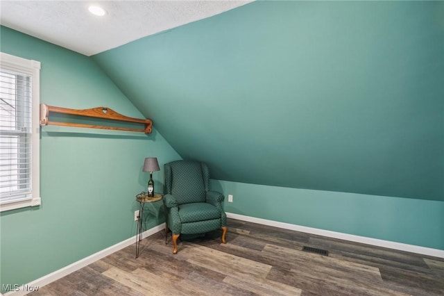 5610 Charles Ave, Parma, OH 44129 - sitting room featuring lofted ceiling, wood finished floors, and baseboards