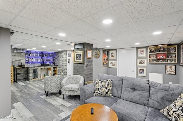 5610 Charles Ave, Parma, OH 44129 - living area featuring wet bar, wood finished floors, and a drop ceiling