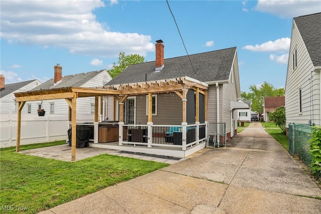 5610 Charles Ave, Parma, OH 44129 - back of property with a pergola, a patio area, a shingled roof, and a chimney