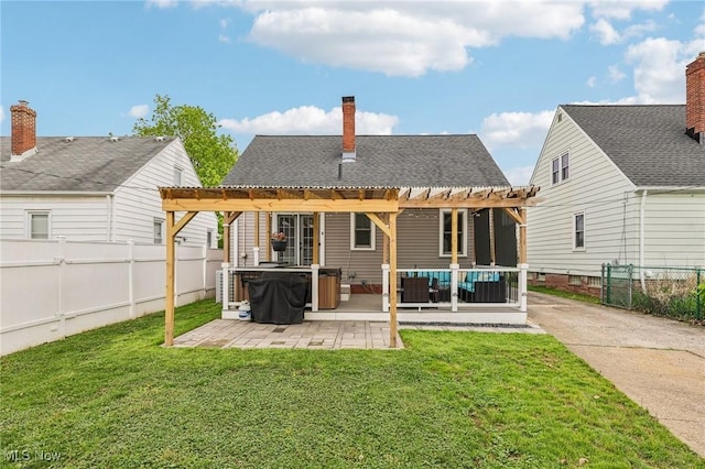 5610 Charles Ave, Parma, OH 44129 - rear view of house featuring a hot tub, a pergola, a patio, a chimney, and an outdoor hangout area