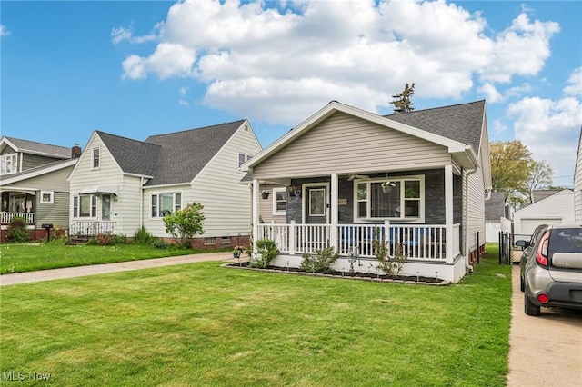 5610 Charles Ave, Parma, OH 44129 - view of front of property featuring covered porch, a front yard, and a ceiling fan
