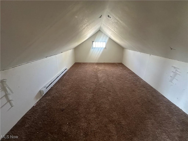 bonus room with a baseboard radiator, lofted ceiling, and carpet floors