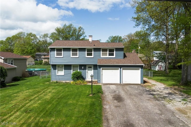 2332 Birch Trace Dr, Austintown, OH 44515 - view of front facade featuring a chimney, driveway, a front lawn, and an attached garage