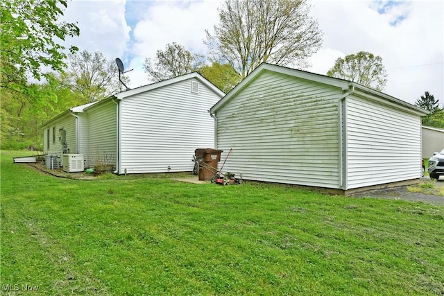 3138 Mccleary Jacoby Rd, Cortland, OH 44410 - view of property exterior with a lawn and central AC unit