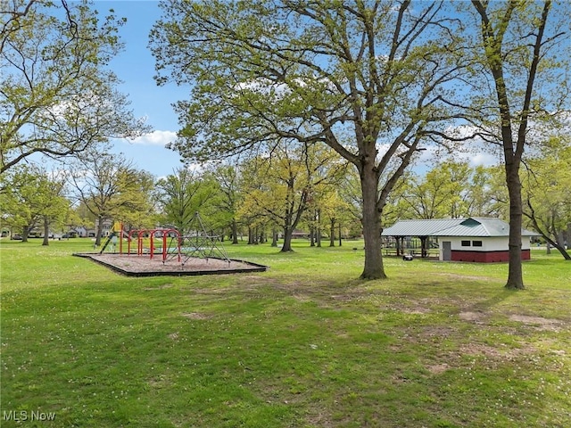 view of community with a playground and a yard