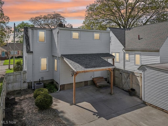 back of house with a patio, fence, a shingled roof, cooling unit, and entry steps
