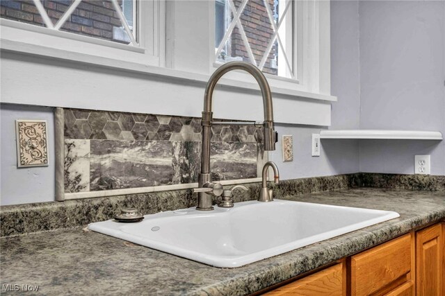 103 N Portage Path, Akron, OH 44303 - kitchen view of a sink, dark countertops, and brown cabinets