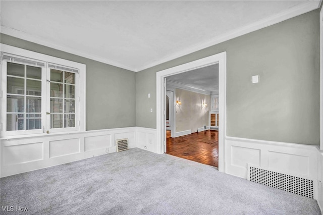 103 N Portage Path, Akron, OH 44303 - empty room with carpet, crown molding, a wainscoted wall, and a decorative wall