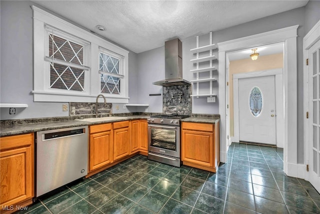 103 N Portage Path, Akron, OH 44303 - kitchen with stainless steel appliances, wall chimney exhaust hood, a sink, dark countertops, and a textured ceiling
