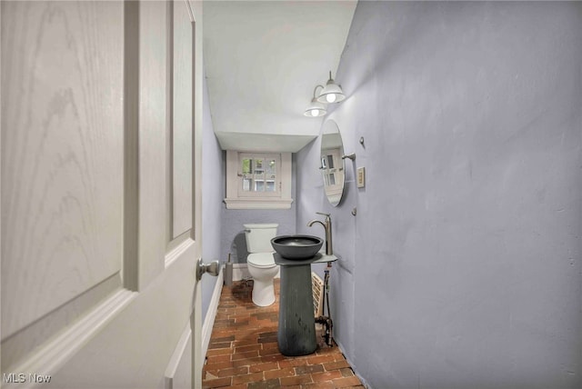 103 N Portage Path, Akron, OH 44303 - bathroom with brick flooring, toilet, and a sink