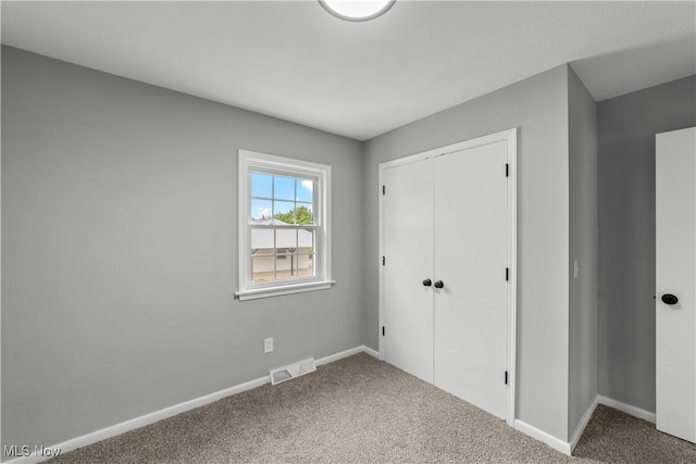 2394 Reimer Rd, Wadsworth, OH 44281 - unfurnished bedroom with carpet, a closet, and baseboards