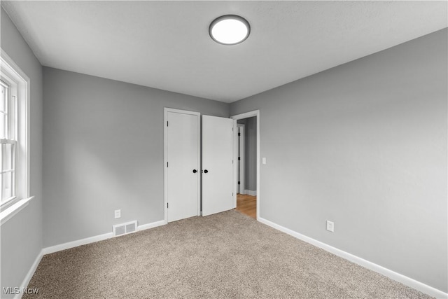 2394 Reimer Rd, Wadsworth, OH 44281 - unfurnished bedroom with carpet and baseboards