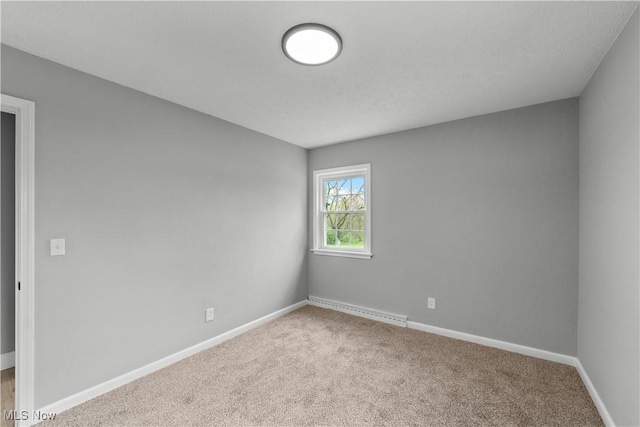 2394 Reimer Rd, Wadsworth, OH 44281 - empty room with a baseboard radiator, carpet flooring, and baseboards