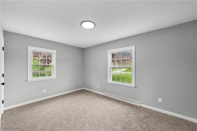 2394 Reimer Rd, Wadsworth, OH 44281 - spare room with baseboard heating, carpet floors, plenty of natural light, and baseboards