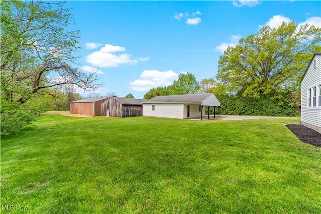 2394 Reimer Rd, Wadsworth, OH 44281 - view of grassy yard with an outdoor structure