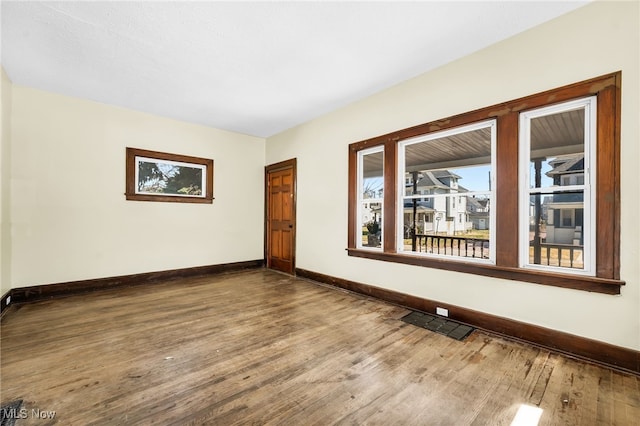 2142 W 95th St, Cleveland, OH 44102 - empty room with baseboards and wood finished floors