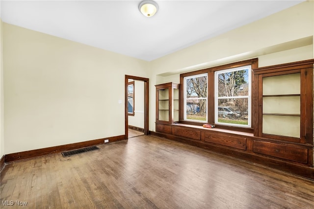 2142 W 95th St, Cleveland, OH 44102 - empty room with wood finished floors and baseboards