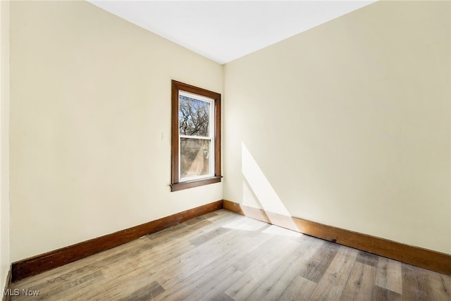2142 W 95th St, Cleveland, OH 44102 - empty room featuring baseboards and light wood finished floors
