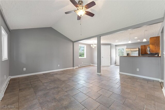 548 51st St SW, Canton, OH 44706 - unfurnished living room with a baseboard heating unit, ceiling fan, baseboards, a textured ceiling, and vaulted ceiling