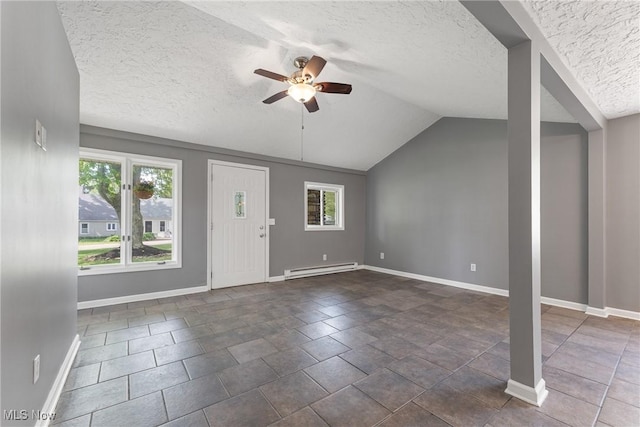 548 51st St SW, Canton, OH 44706 - entryway with a ceiling fan, baseboards, a textured ceiling, vaulted ceiling, and a baseboard heating unit