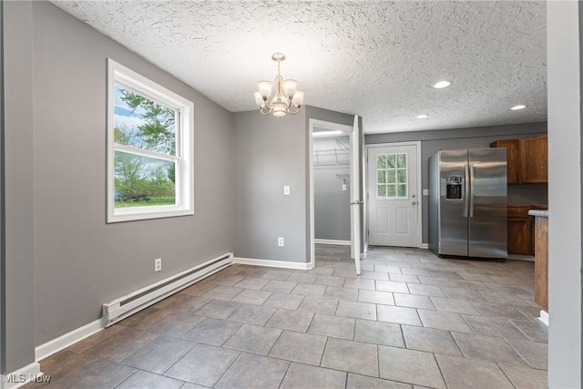 548 51st St SW, Canton, OH 44706 - unfurnished dining area with baseboard heating, a chandelier, recessed lighting, baseboards, and a textured ceiling