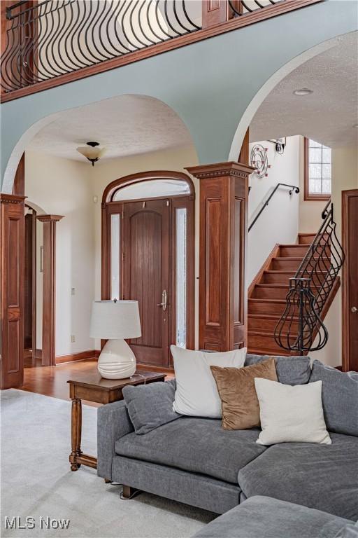 425 Woodside Ave, Jefferson, OH 44047 - living area with arched walkways and stairs