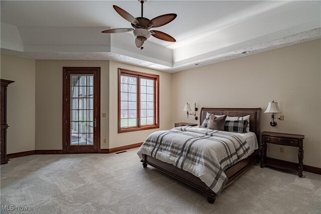 425 Woodside Ave, Jefferson, OH 44047 - bedroom with a raised ceiling, light carpet, baseboards, and a ceiling fan