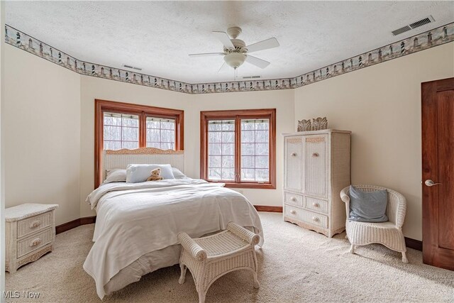 425 Woodside Ave, Jefferson, OH 44047 - bedroom featuring light colored carpet, baseboards, a textured ceiling, and ceiling fan