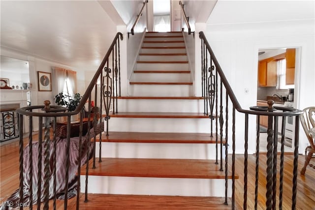 stairway with wood finished floors