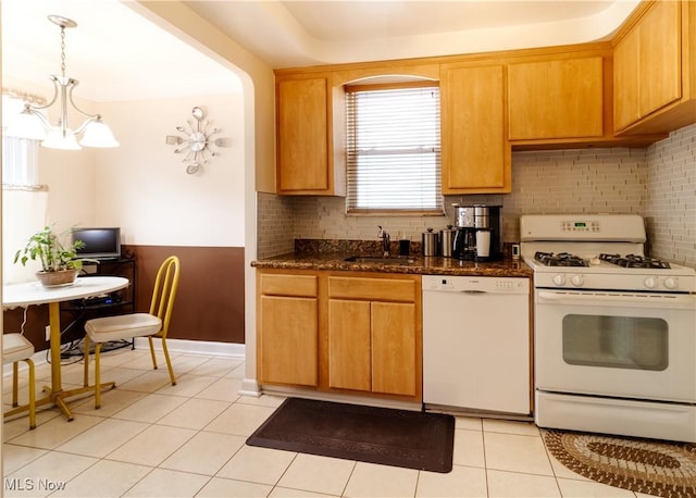 kitchen with white appliances, a sink, decorative backsplash, a chandelier, and light tile patterned floors