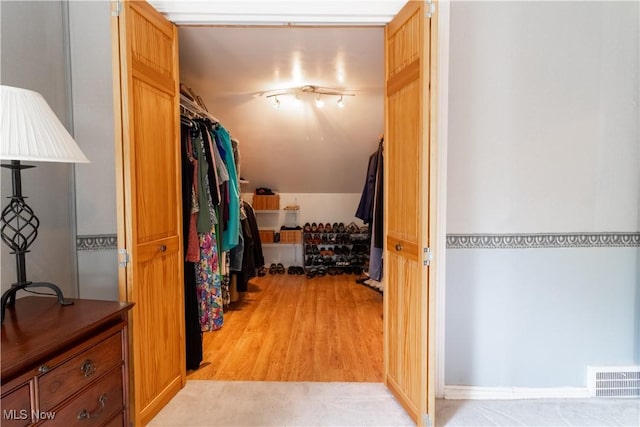 walk in closet featuring light wood-style floors