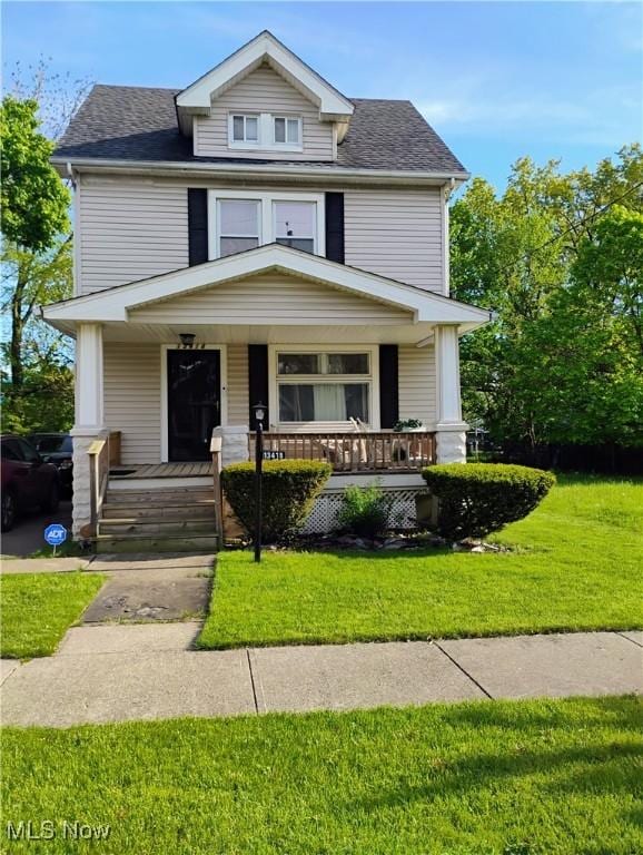 13418 Coath Ave, Cleveland, OH 44120 - traditional style home featuring a porch, a front yard, and roof with shingles