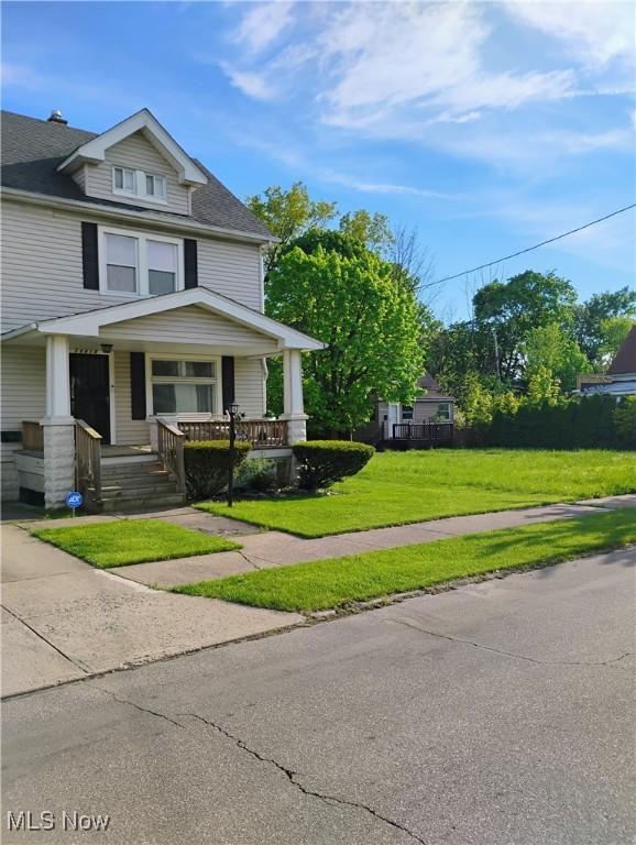13418 Coath Ave, Cleveland, OH 44120 - american foursquare style home featuring covered porch, a front lawn, and a shingled roof