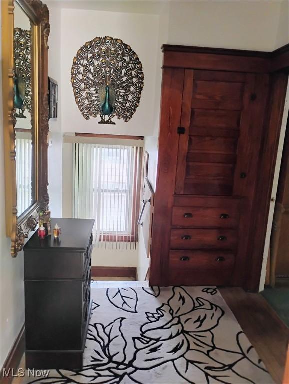 13418 Coath Ave, Cleveland, OH 44120 - bedroom featuring multiple windows, baseboards, and wood finished floors