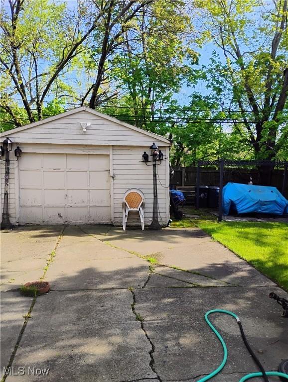 13418 Coath Ave, Cleveland, OH 44120 - detached garage with fence and concrete driveway