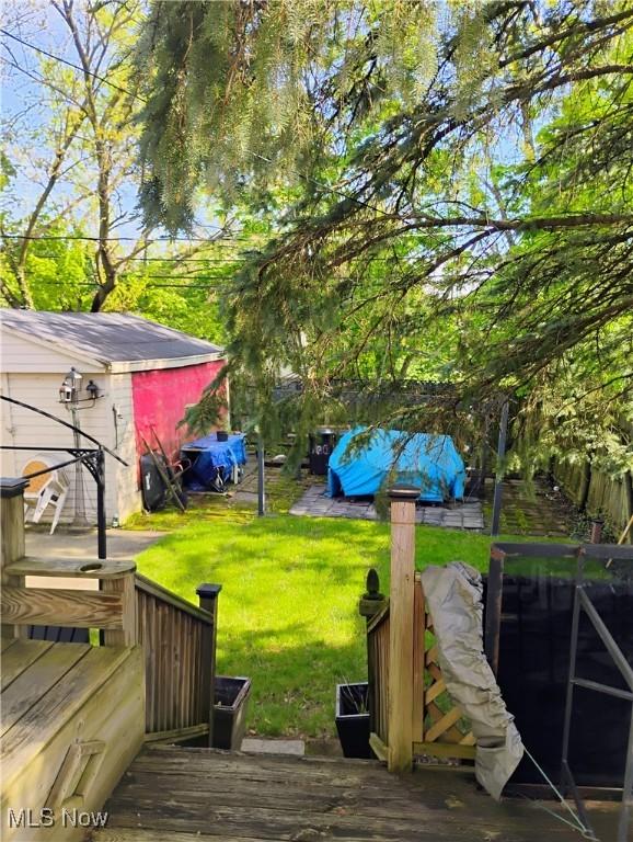 13418 Coath Ave, Cleveland, OH 44120 - view of grassy yard with a wooden deck
