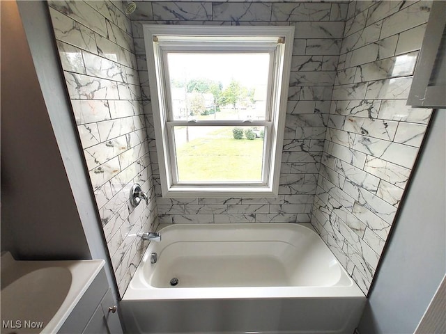 bathroom with a tub to relax in